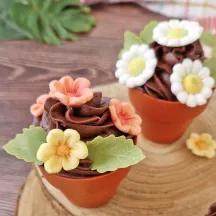 Pink flowers and green leaves made from sugar
