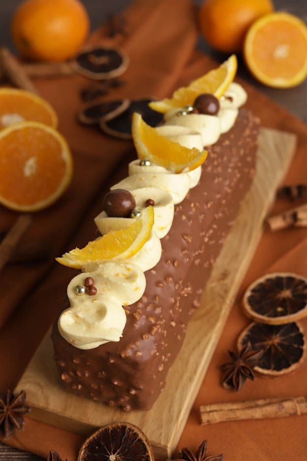 Sliced orange gingerbread cake with orange ganache and Rocher icing