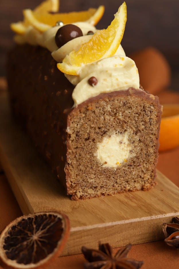 Sliced orange gingerbread cake with orange ganache and Rocher icing