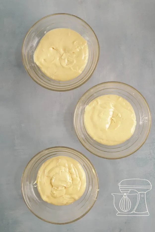 Smooth, homogeneous cake batter in the Mixing bowl · Batter divided into three bowls · Three bowls with 140 g of cake batter each
