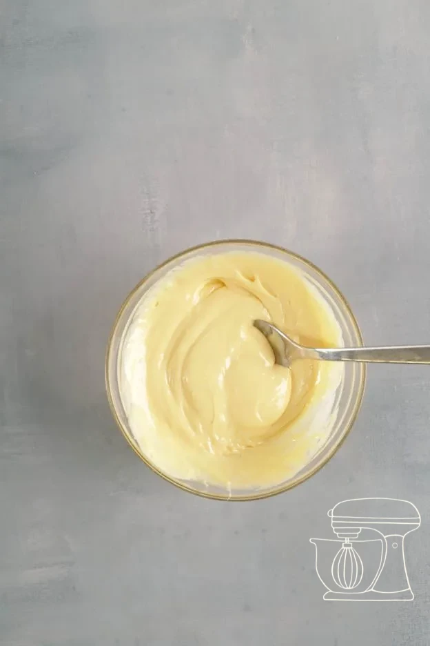 White chocolate melting in the microwave · Melted white chocolate added to the batter · Pale batter with white chocolate stirred through