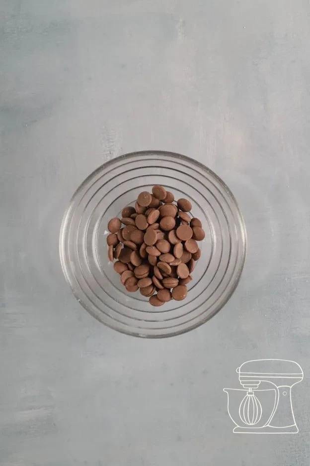 Milk chocolate being melted and stirred · Melted Milk chocolate added to the second Bowl · Medium-brown batter with Milk chocolate