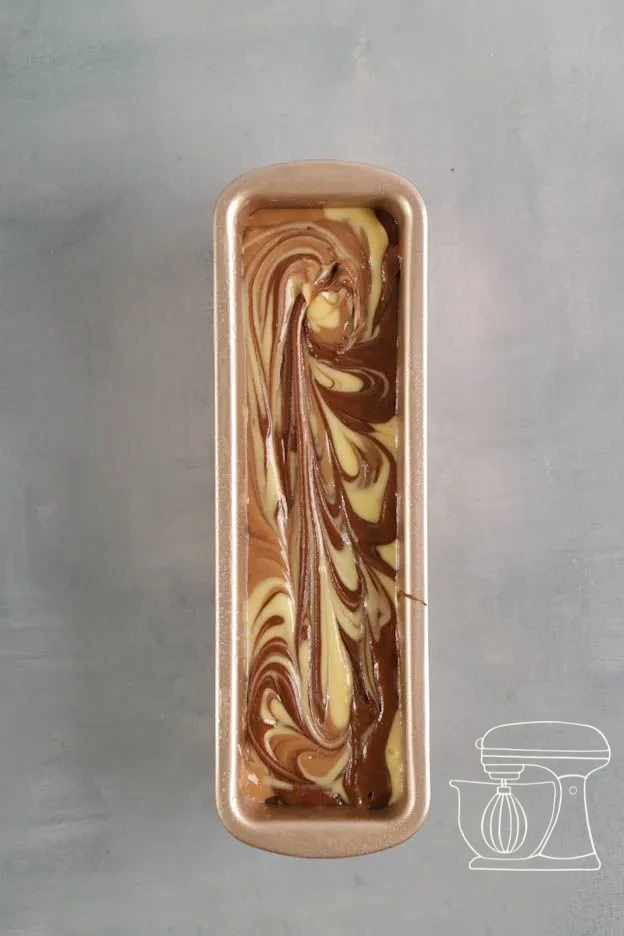 Marble cake baking in the oven and risen