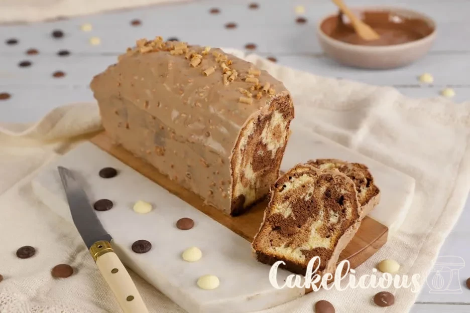 Sliced 4 chocolate marble cake with caramel icing and Hazelnut brittle