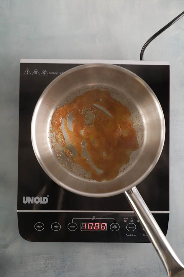 Adding hot cream to the caramel for the cremeux