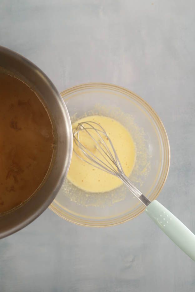Caramel poured into the egg mixture for the cremeux
