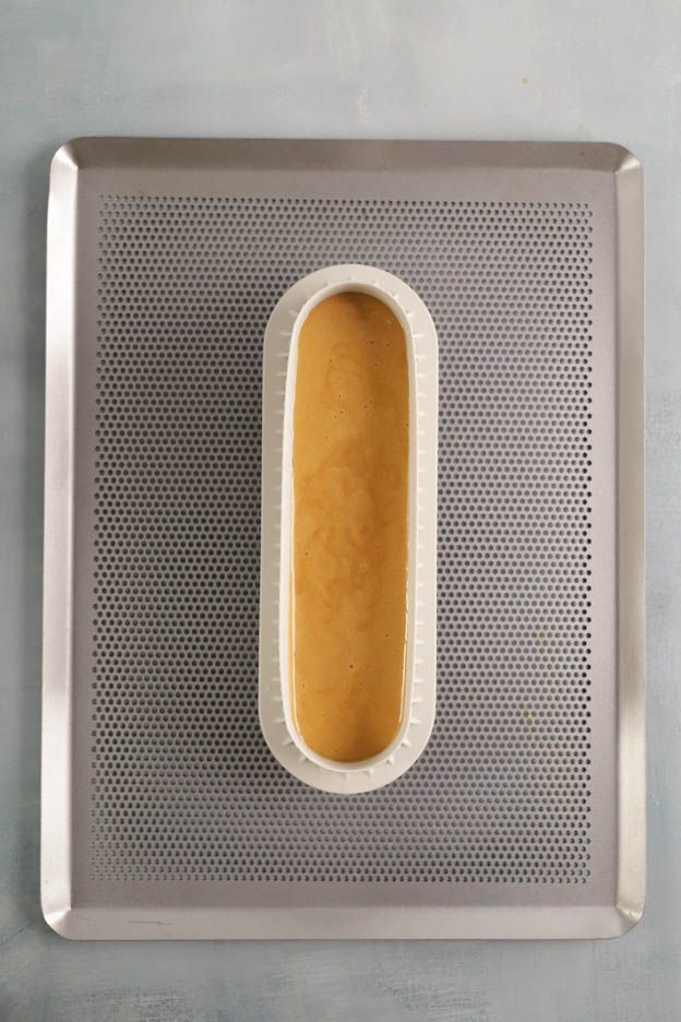 Saucepan with base layer of sugar for caramel preparation