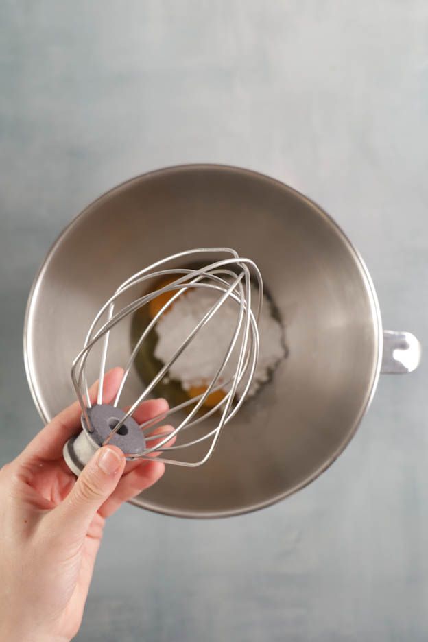 Pouring caramel into the egg and sugar preparation