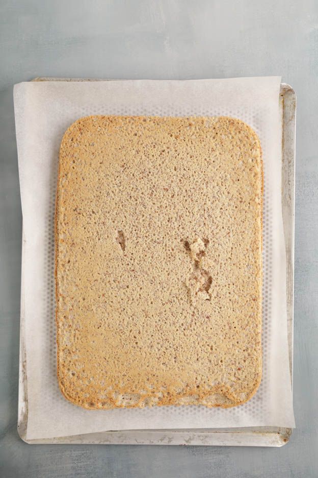 Piping bag filled with praline to fill the yule log