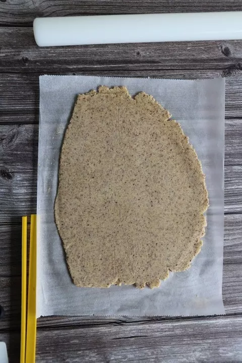 Top sheet of baking paper being peeled off