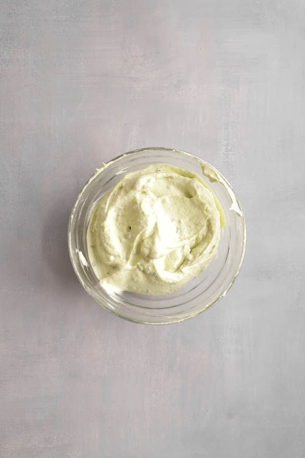 Airy whipped avocado mousse in a glass bowl ready for the brick tartlets