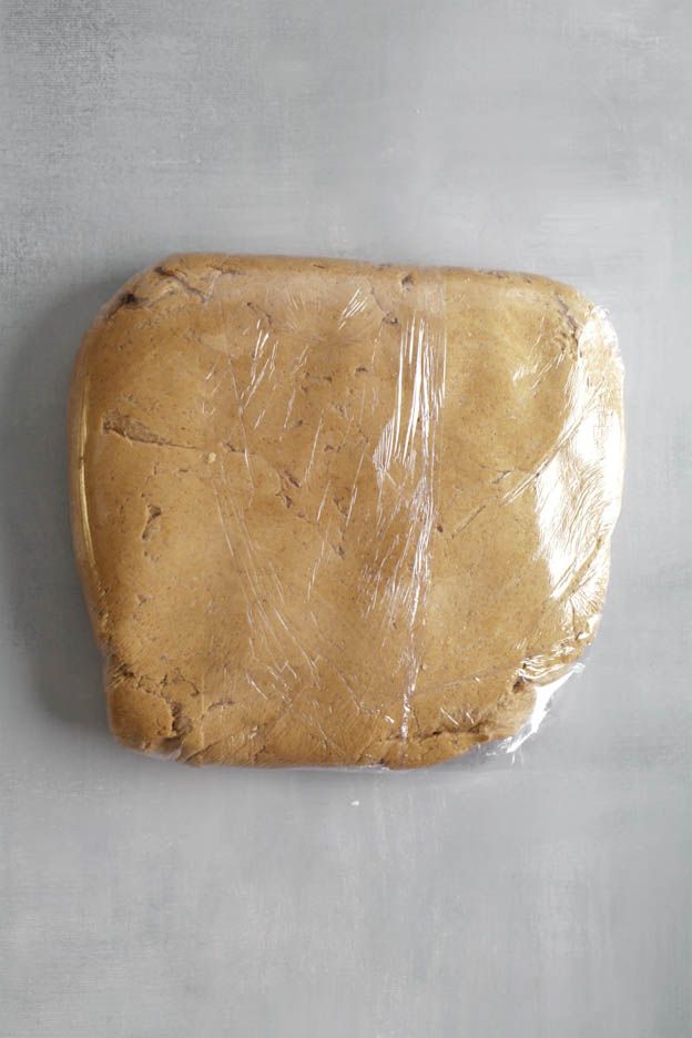 Dough being wrapped in cling film