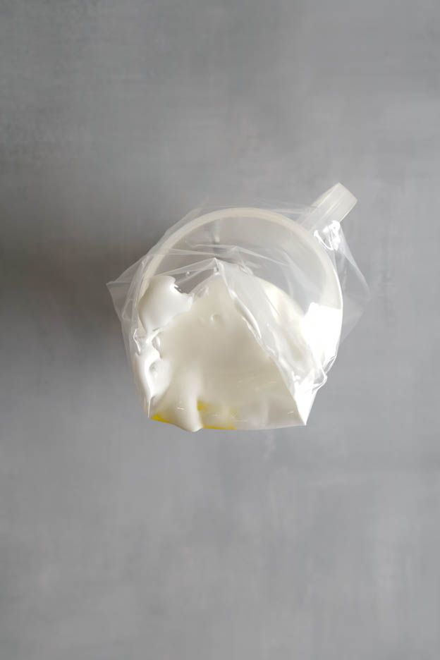 Piping bag standing in the measuring cup