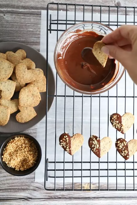 A biscuit is dipped halfway in