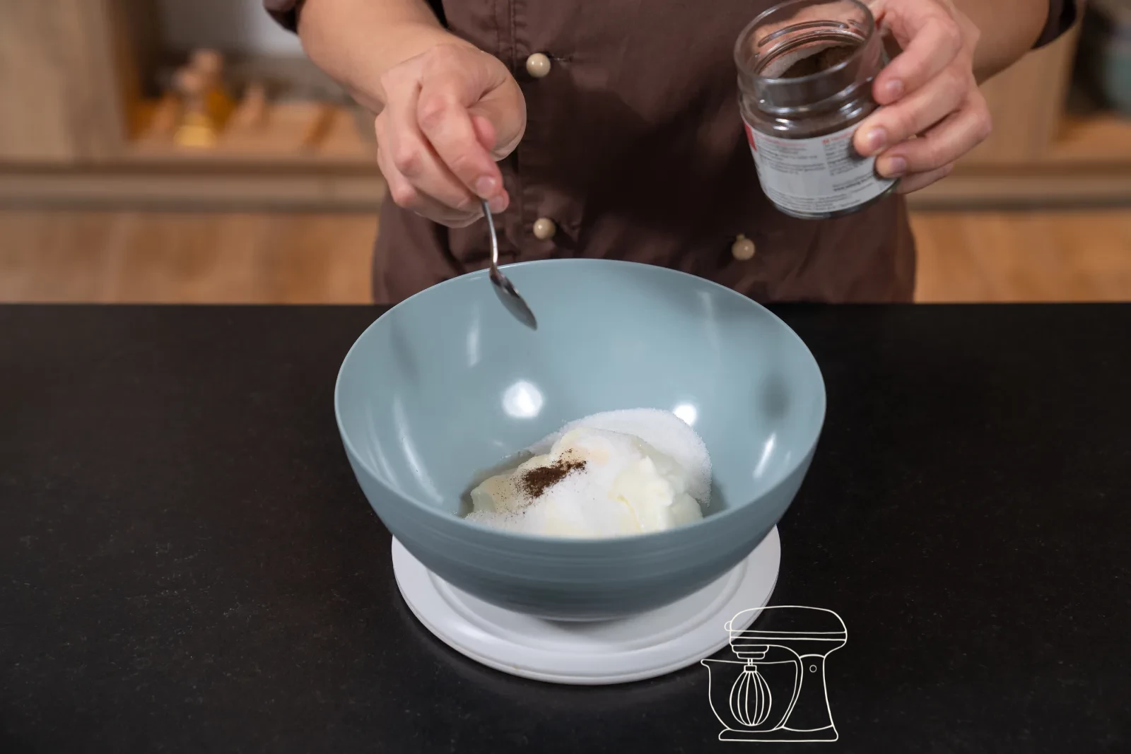 Creamy quark mixture in a bowl, a dough scraper folding in whipped cream in three portions