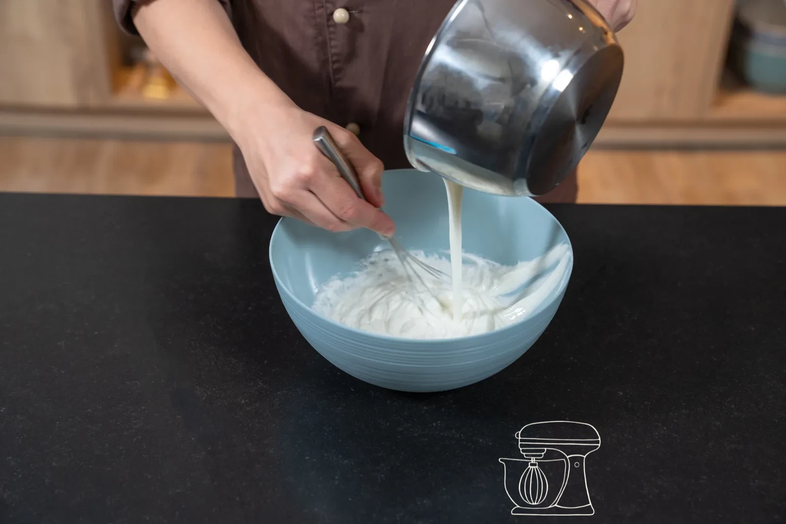 Creamy quark mixture in a bowl, a dough scraper folding in whipped cream in three portions