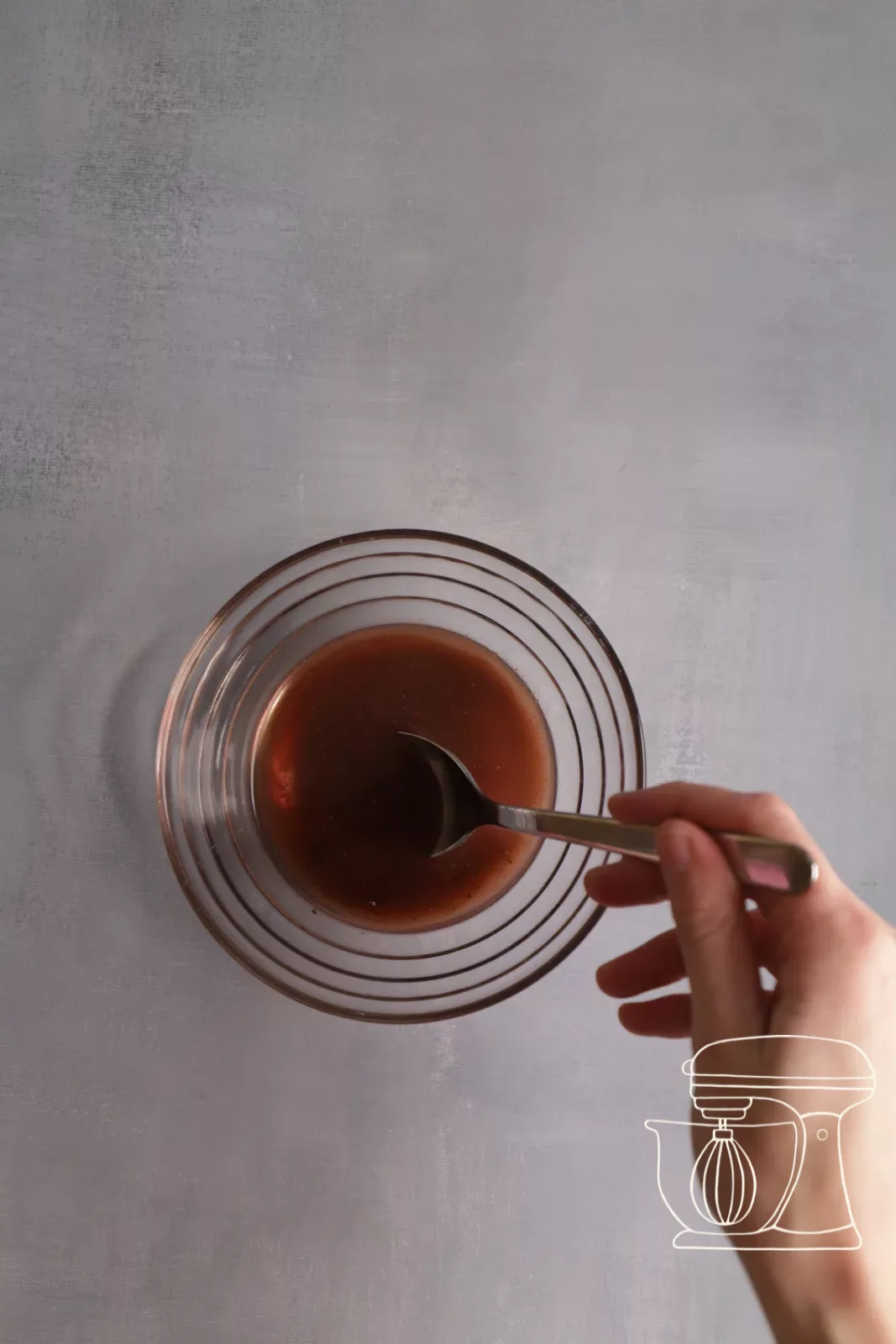 Fake blood is stirred with a spoon