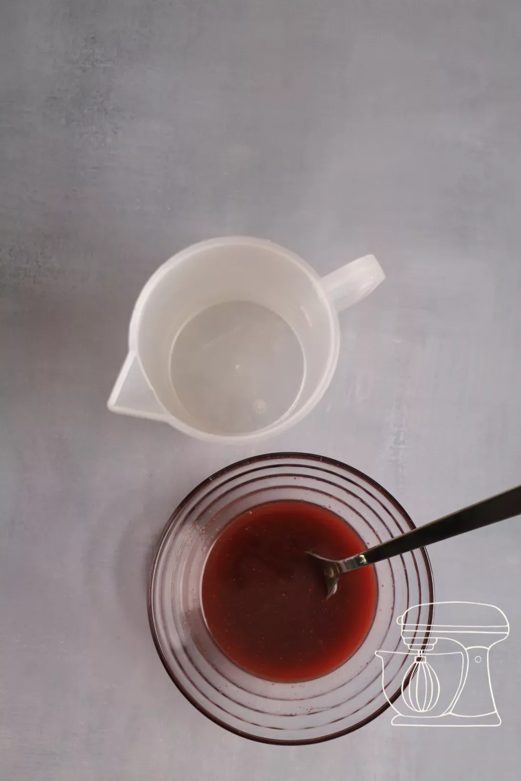 Fake blood is transferred into a measuring cup