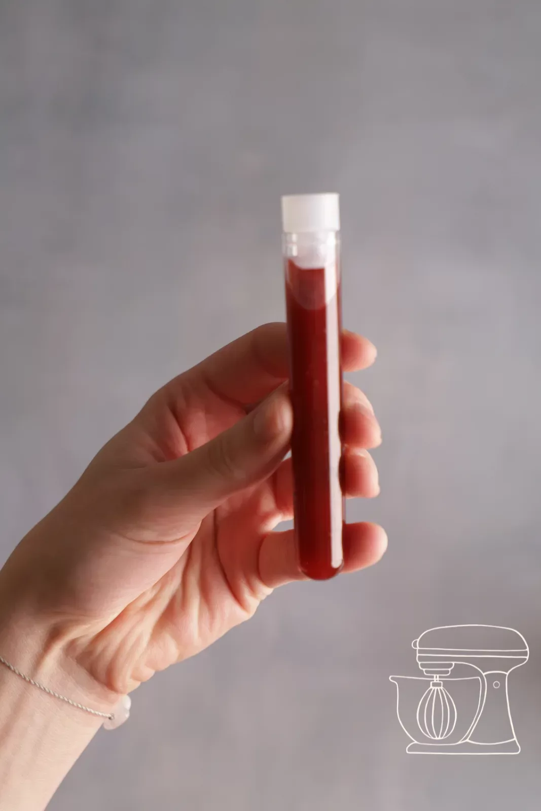 Sticker being placed on a filled test tube