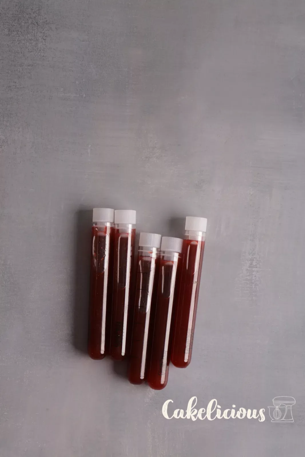 Blood sample shots in test tubes with red fake blood for the Halloween party