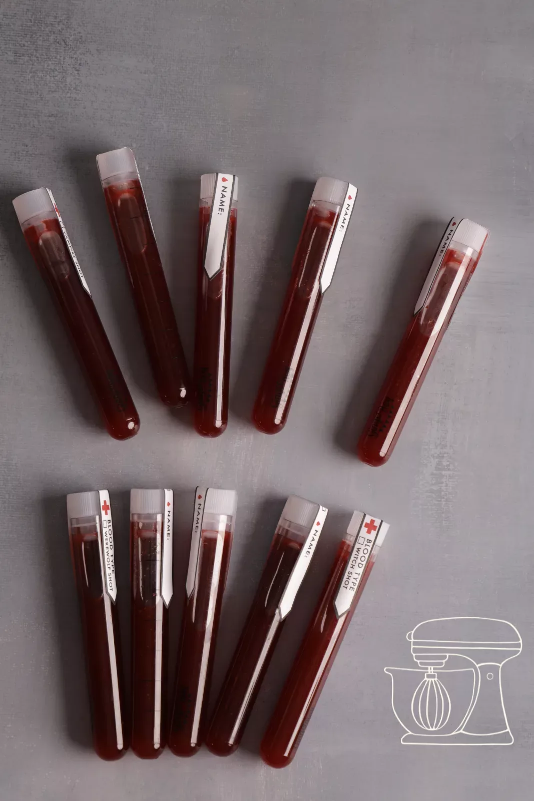 Blood sample shots with alcohol ready for the Halloween party