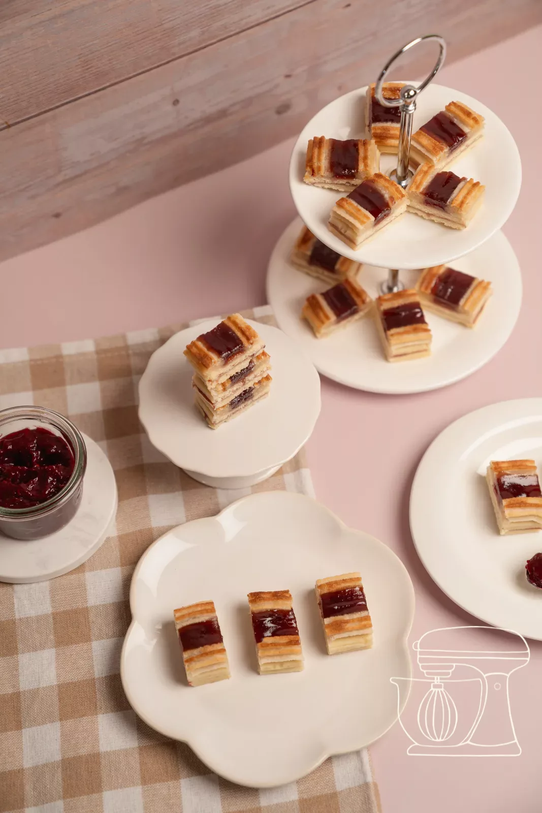 Finished filled strips of the railway worker recipe biscuits with glossy raspberry jam
