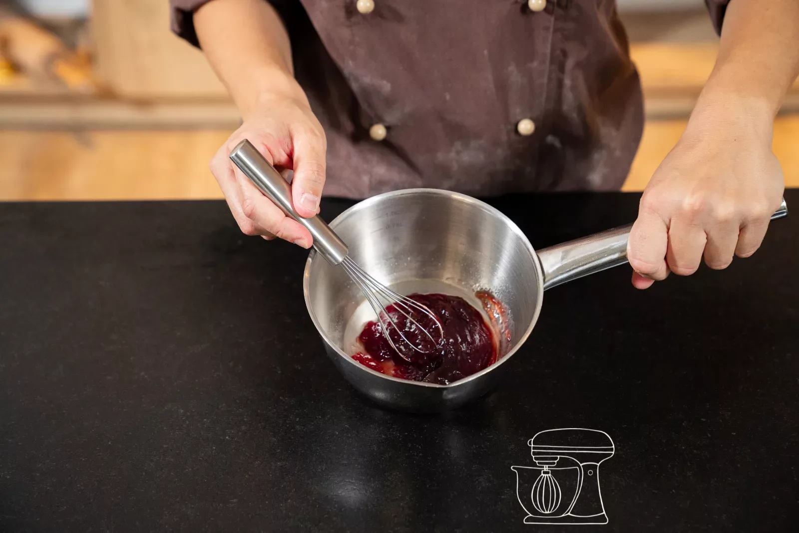 Hot raspberry jam in a pan for the filling