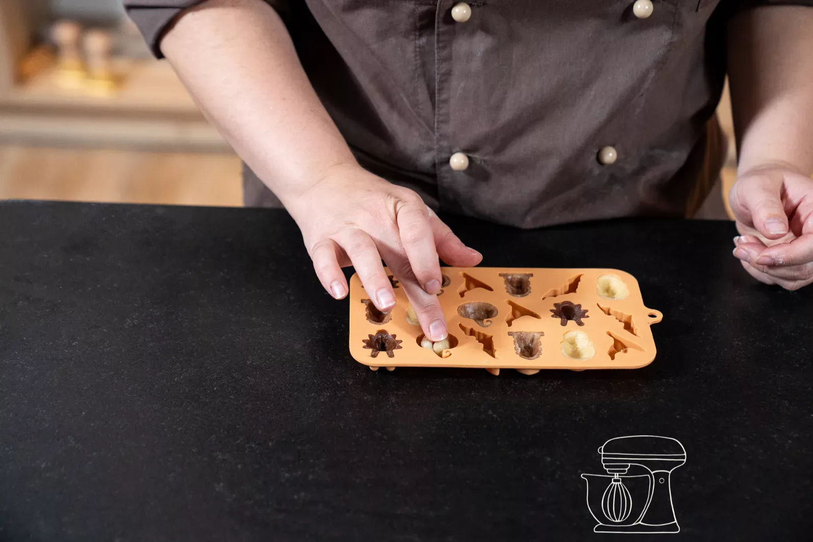 Press dough into the cavities of the silicone mold