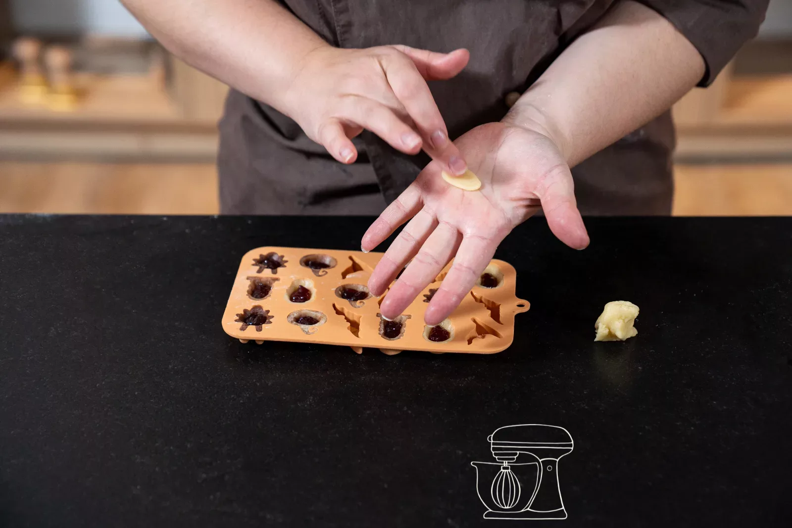 Flatten a piece of dough in the palm of your hand