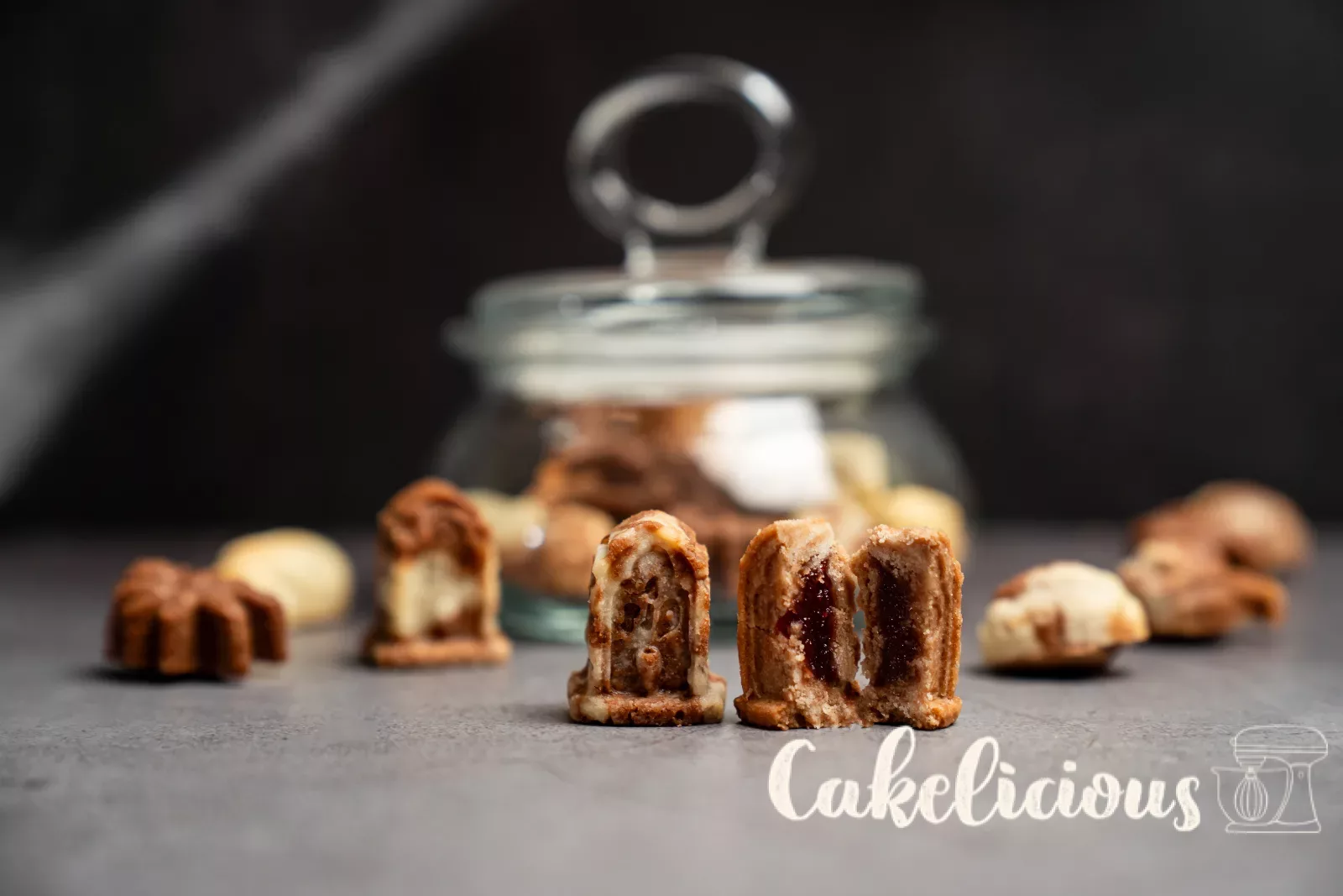 Halved tombstone biscuits reveal the berry filling