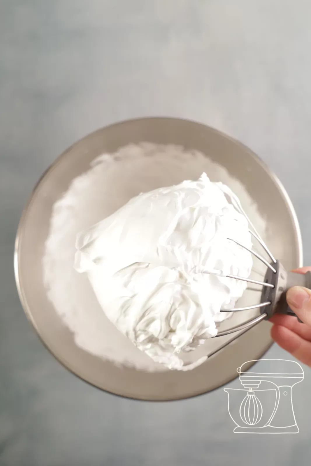 Firmly whipped meringue on the whisk