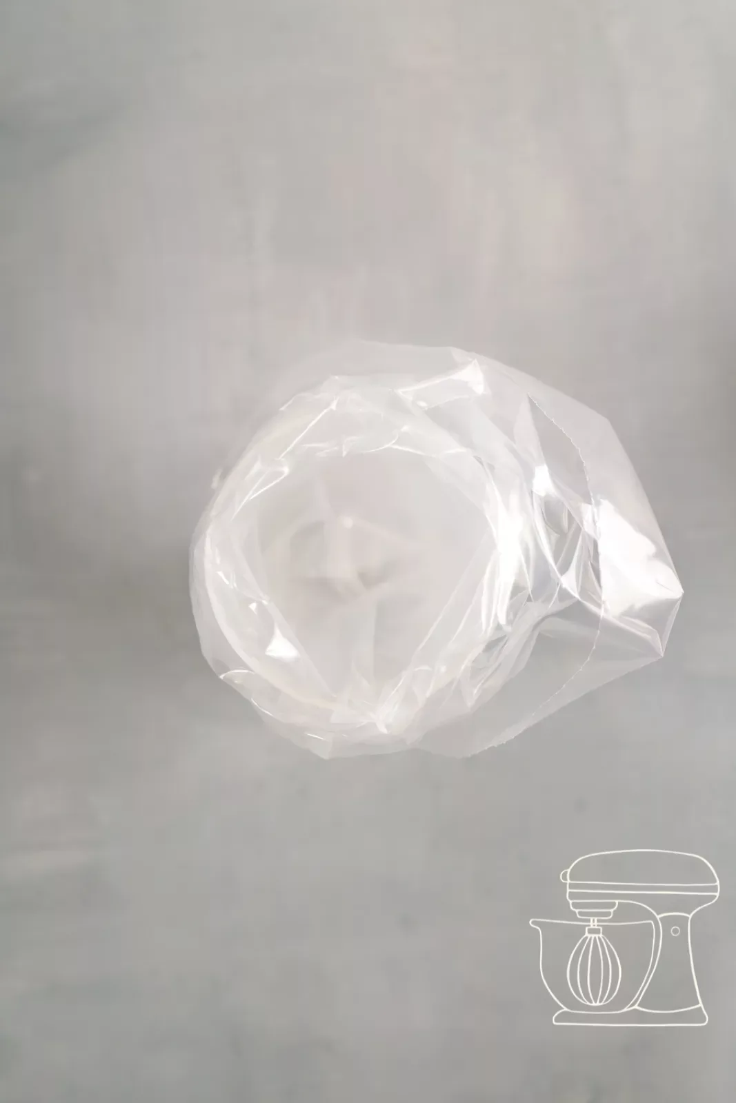 Piping bag placed into a measuring cup