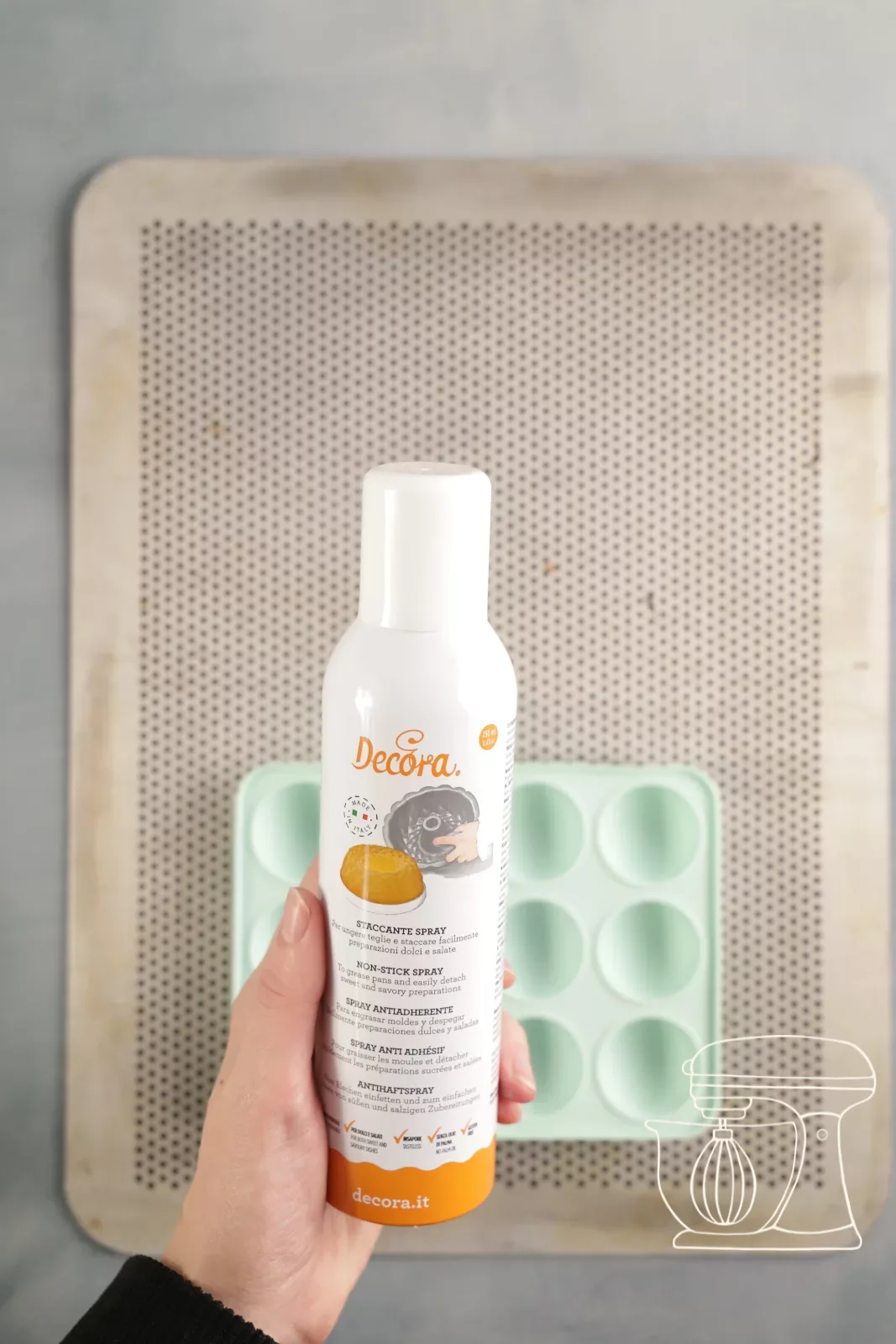 Baking tin being sprayed with non-stick spray