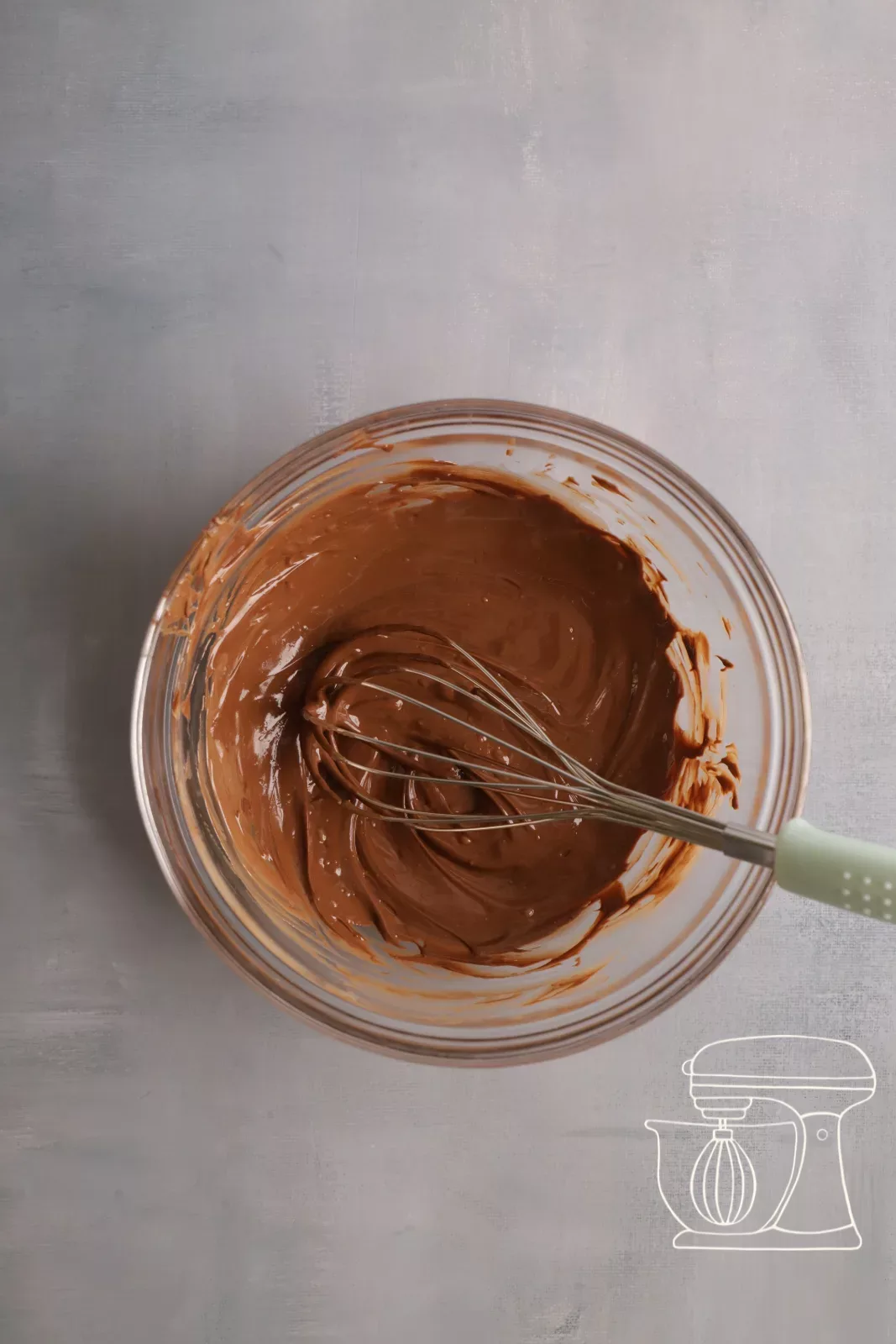 Melted chocolate is stirred with the Whisk