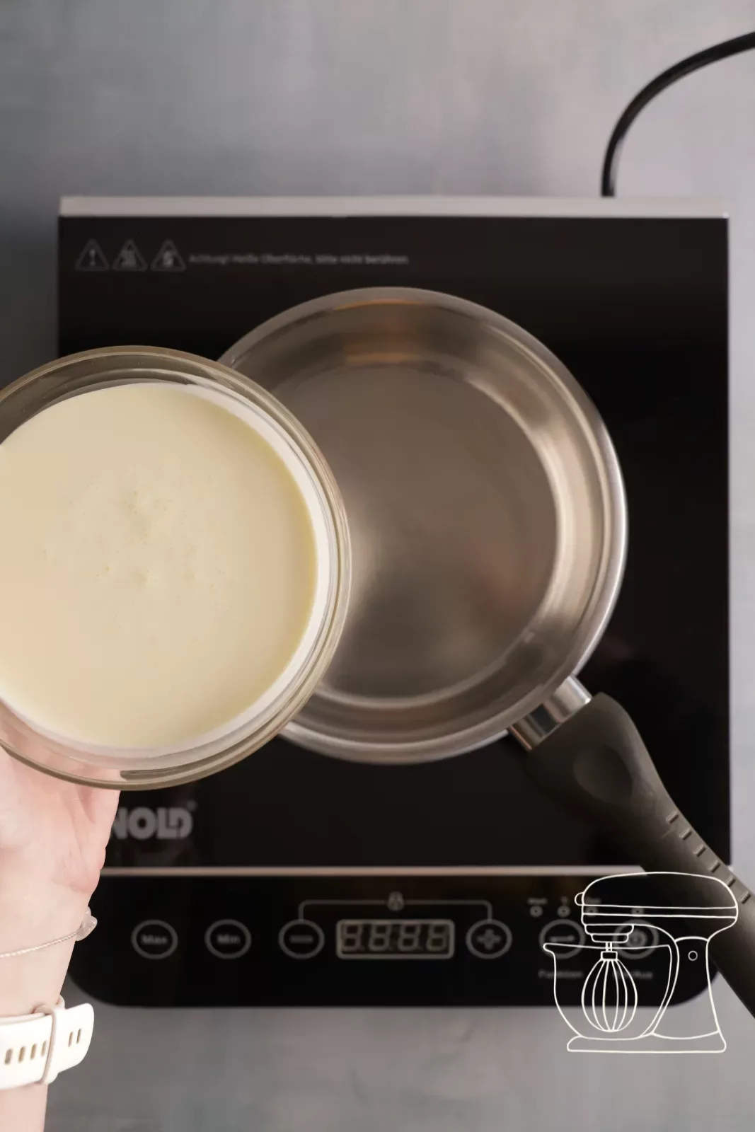 Full cream is poured into a pot