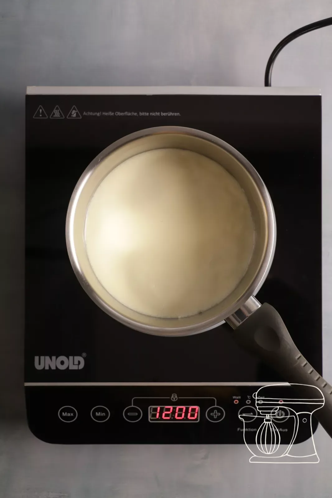 Cream is heated on the stove