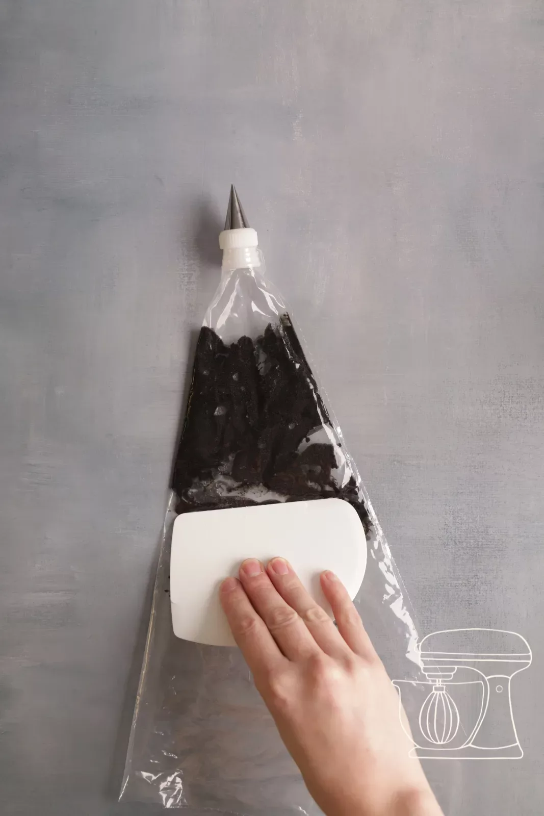 Paste is pushed forward with a dough scraper