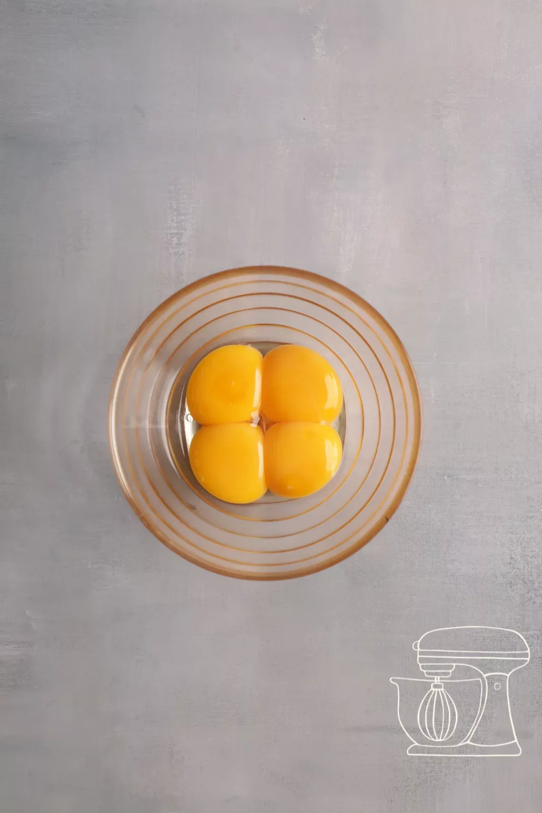 Egg yolk being added to the meringue