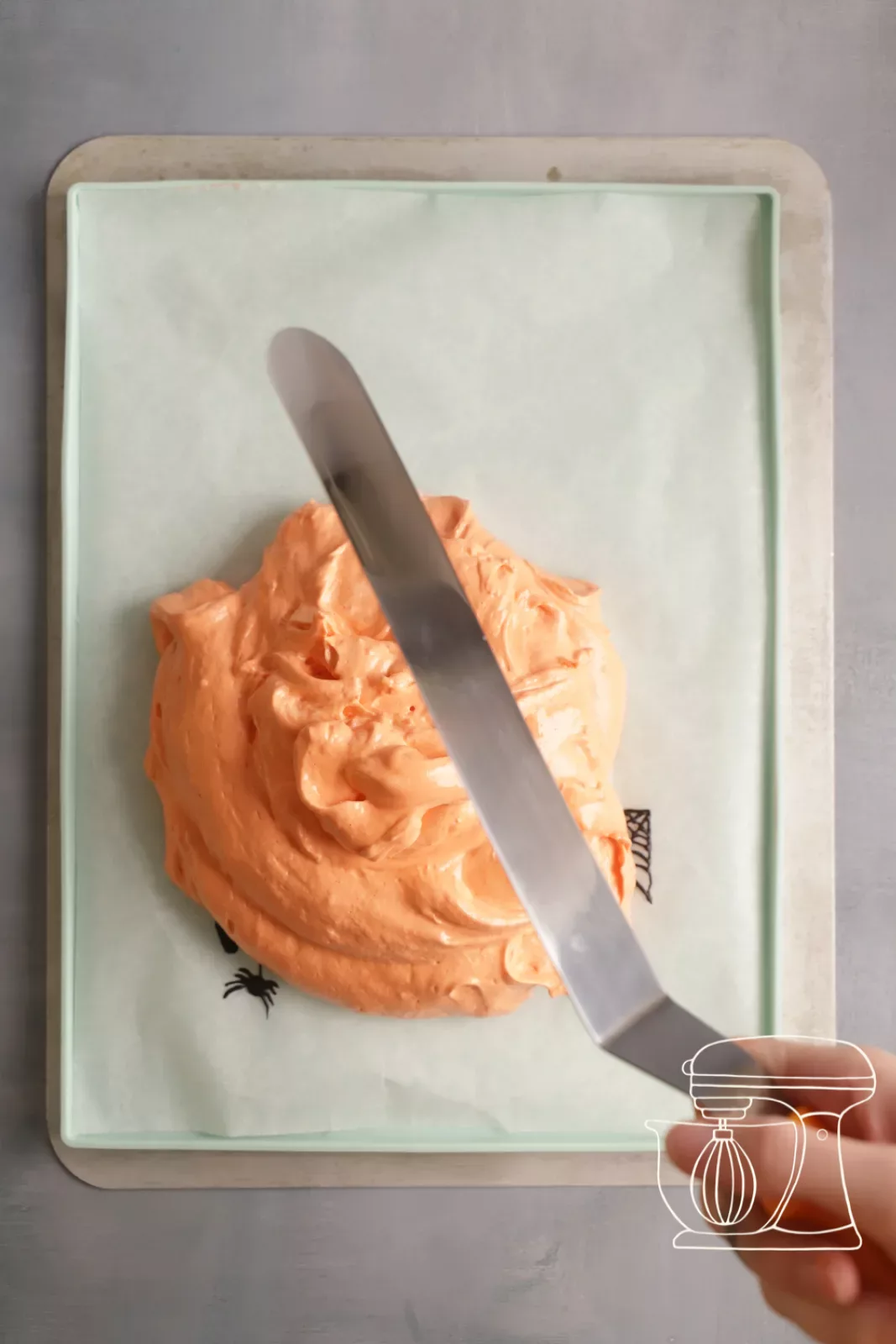 Sponge batter being smoothed with the Angled spatula