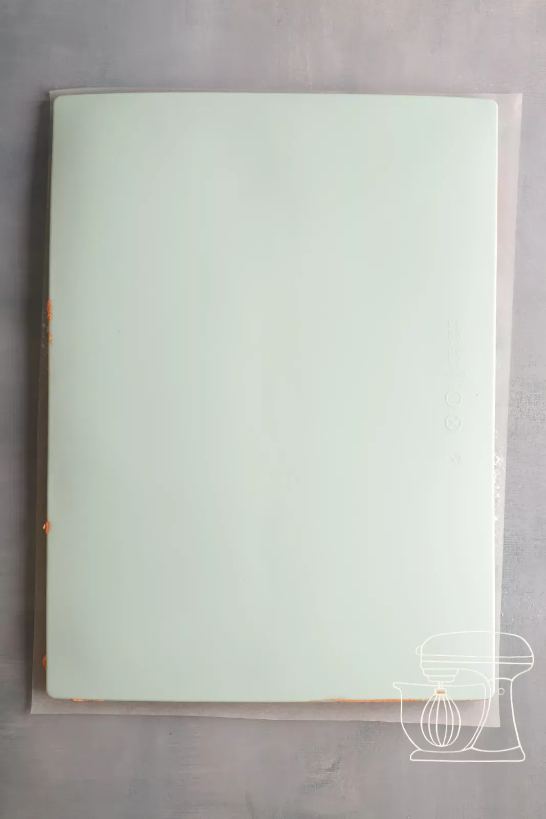 Sponge being turned out onto the baking paper