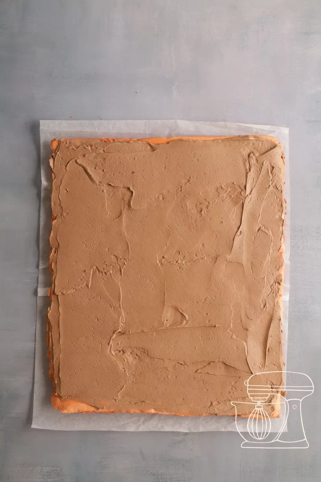 Sponge being rolled up with the Ganache