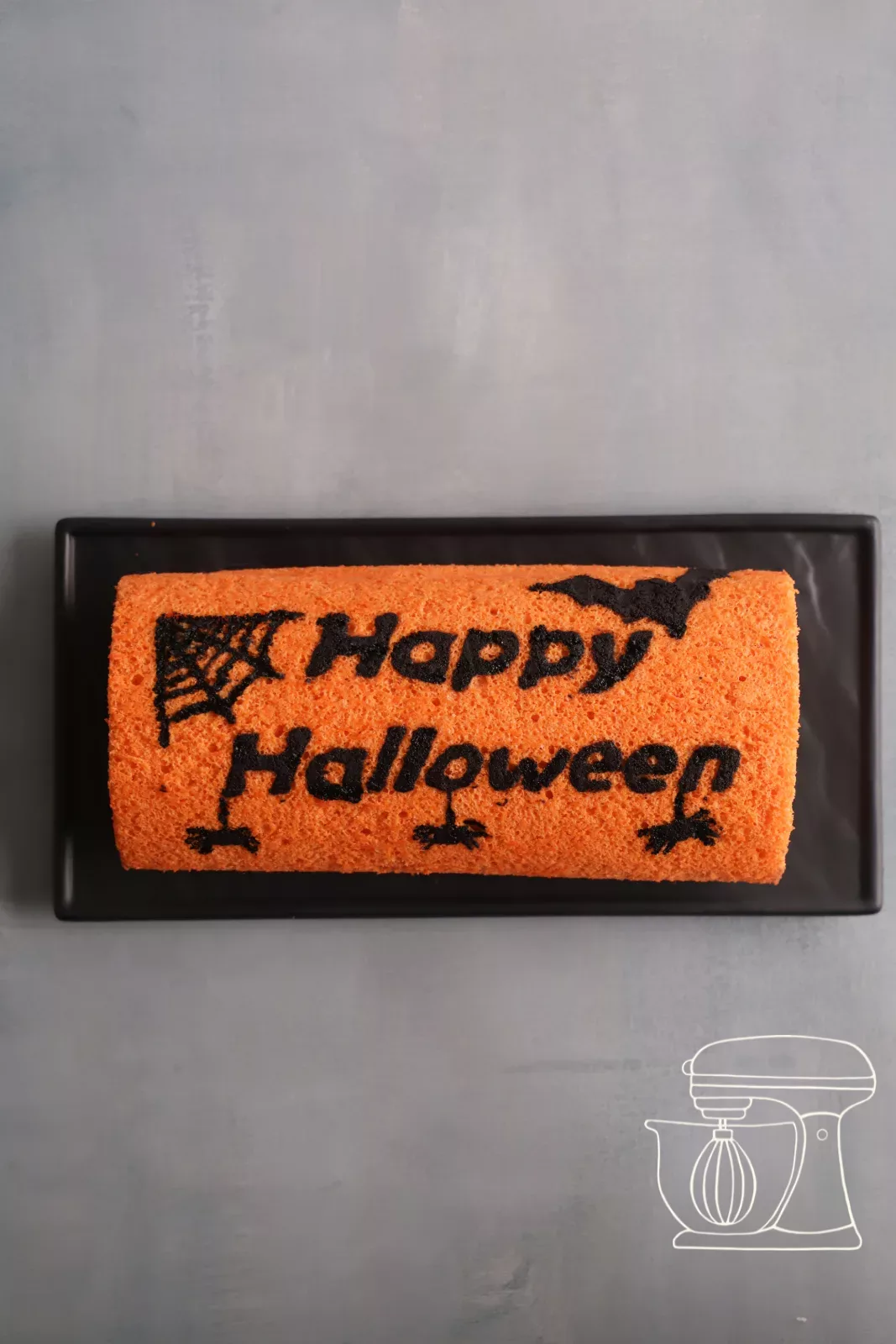 Finished Halloween chocolate roulade with black motifs
