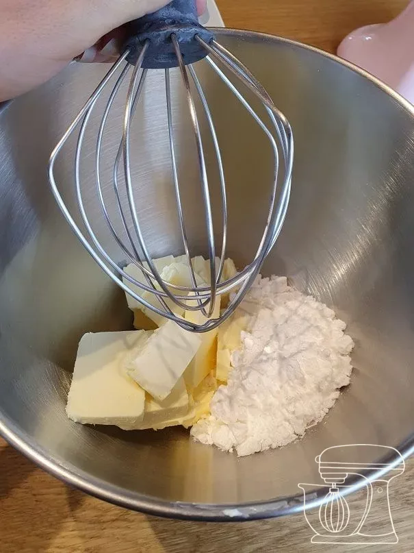 Butter being beaten with the icing sugar