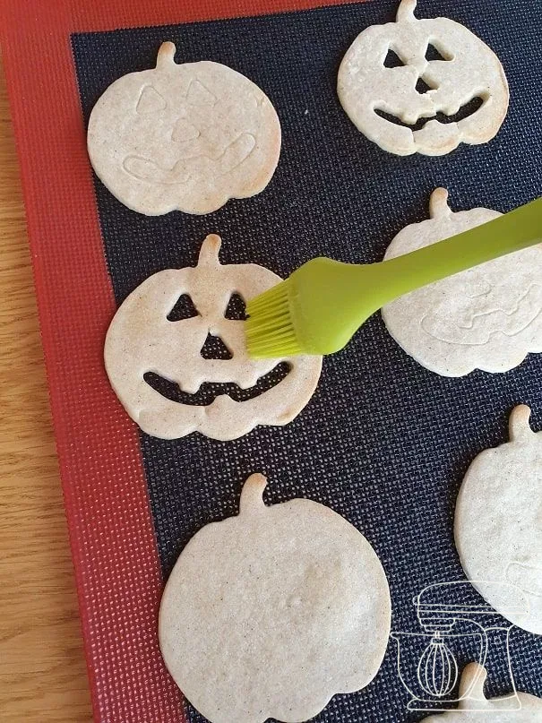 Warm cookies being brushed with melted butter