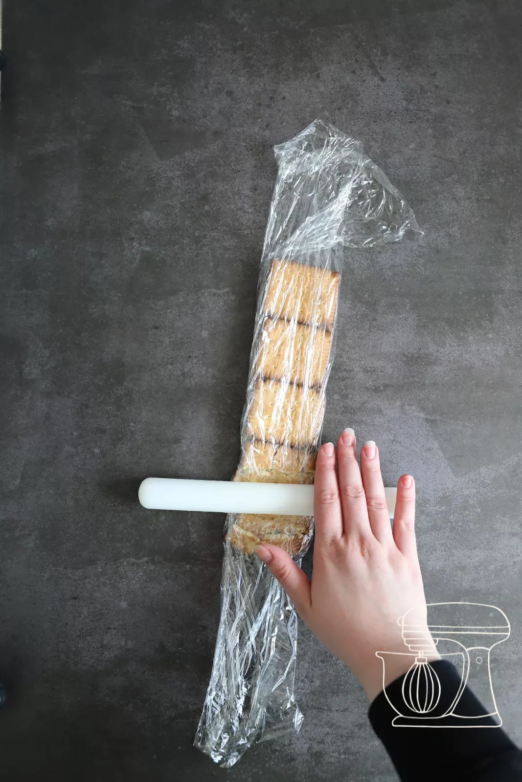 Biscuits being crumbled with the rolling pin