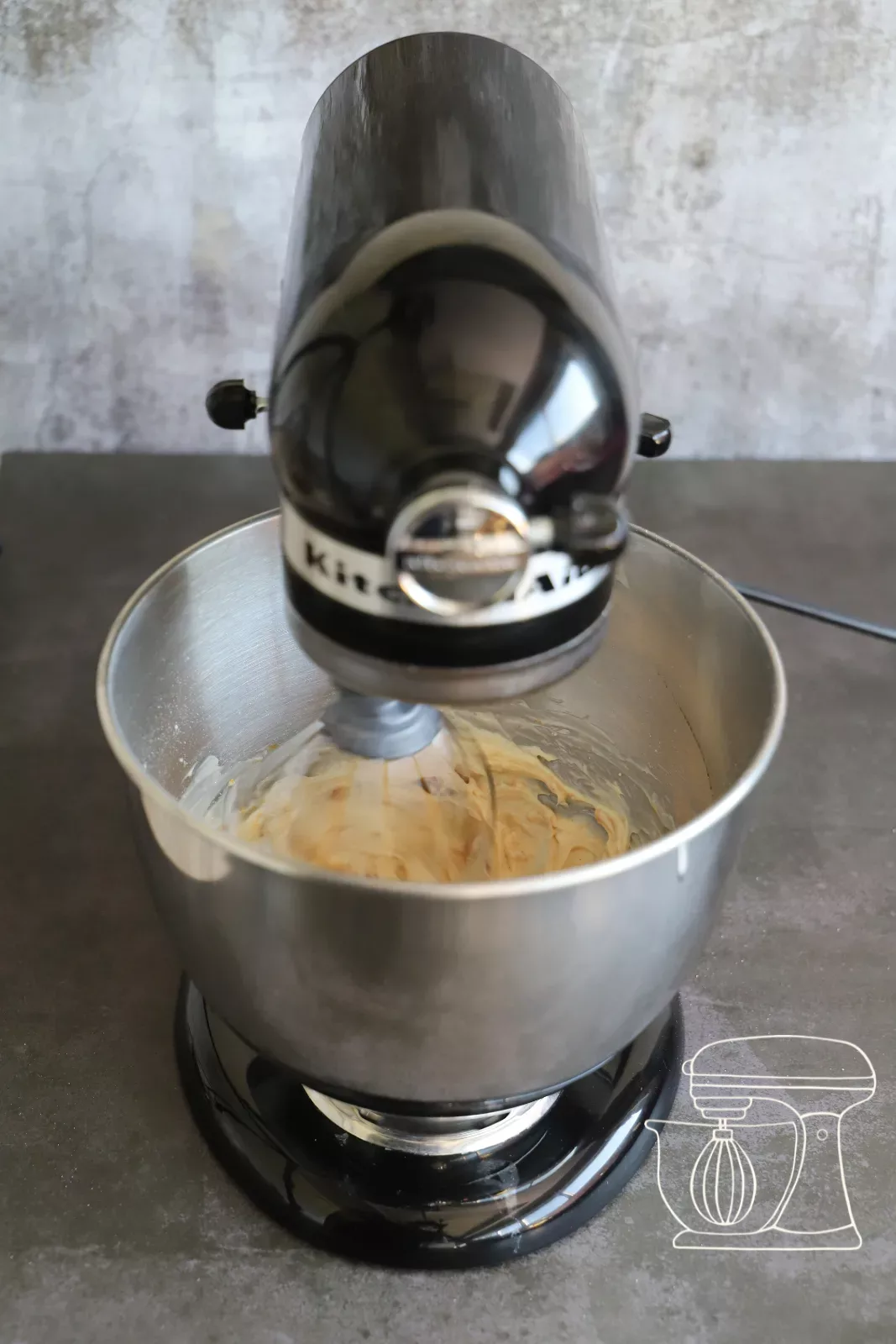 Cheesecake mixture being mixed with the stand mixer