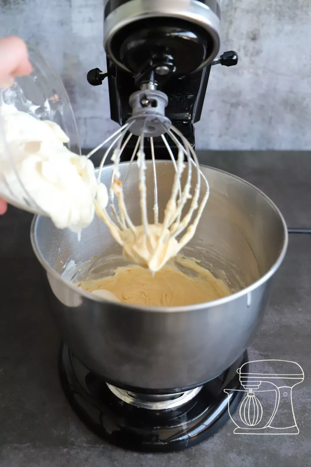 Whipped cream being added to the mixture