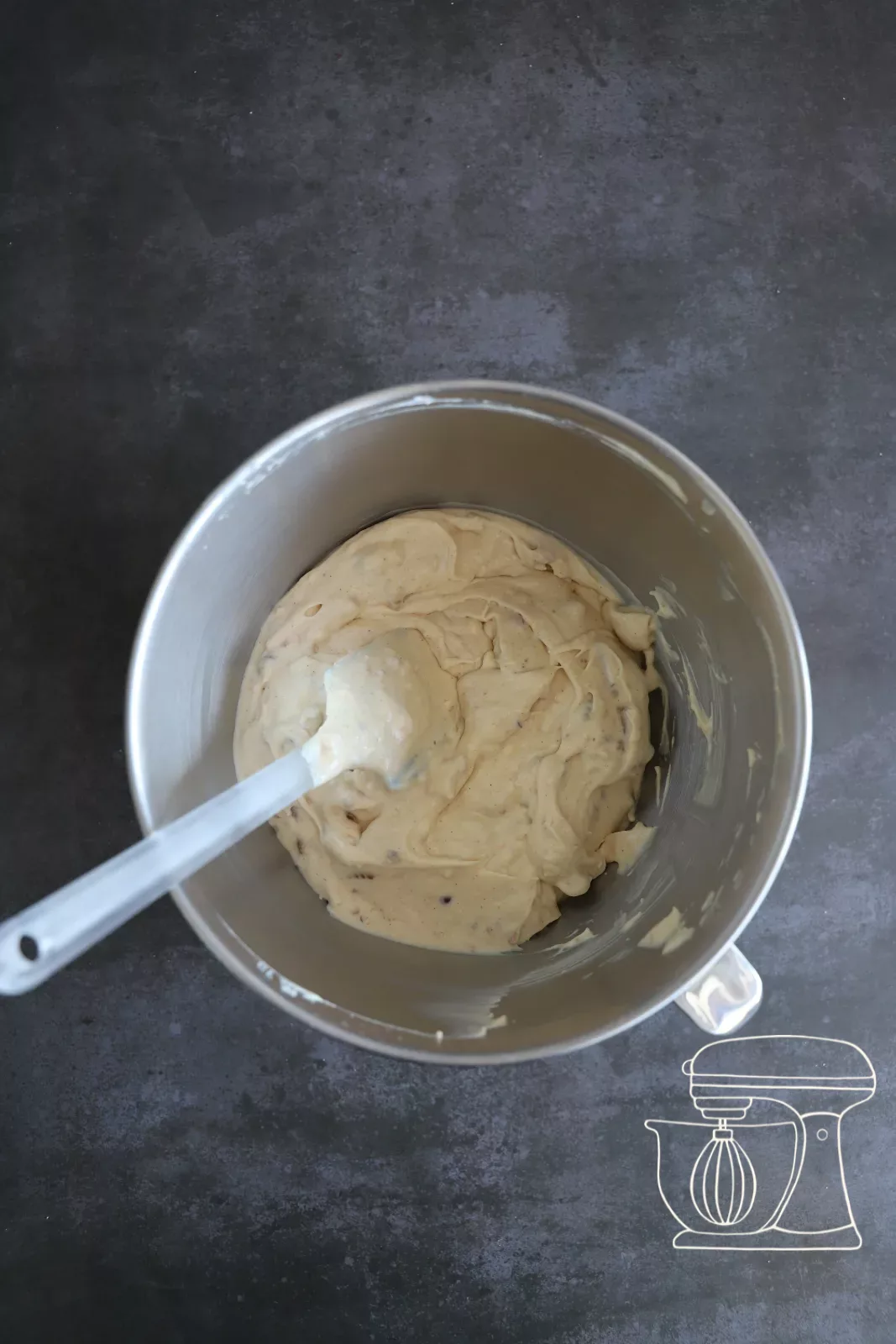 Mixture being gently folded in with the Dough scraper