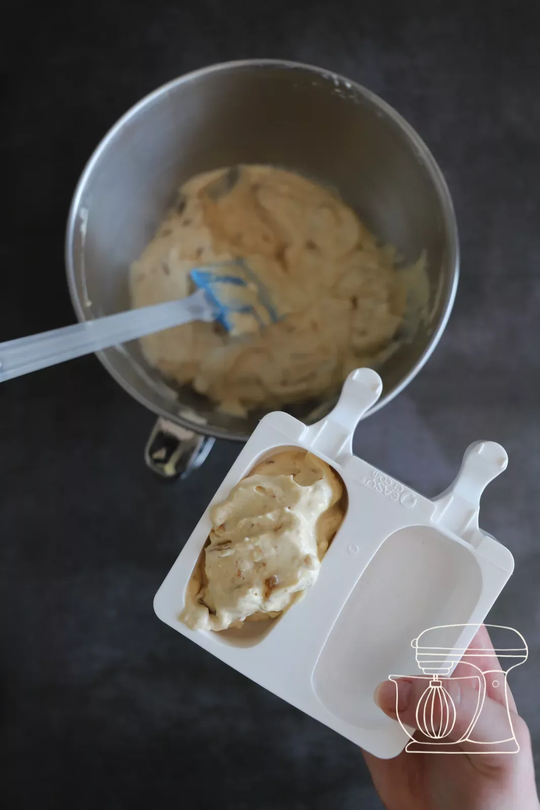 Mixture being smoothed out with a spatula