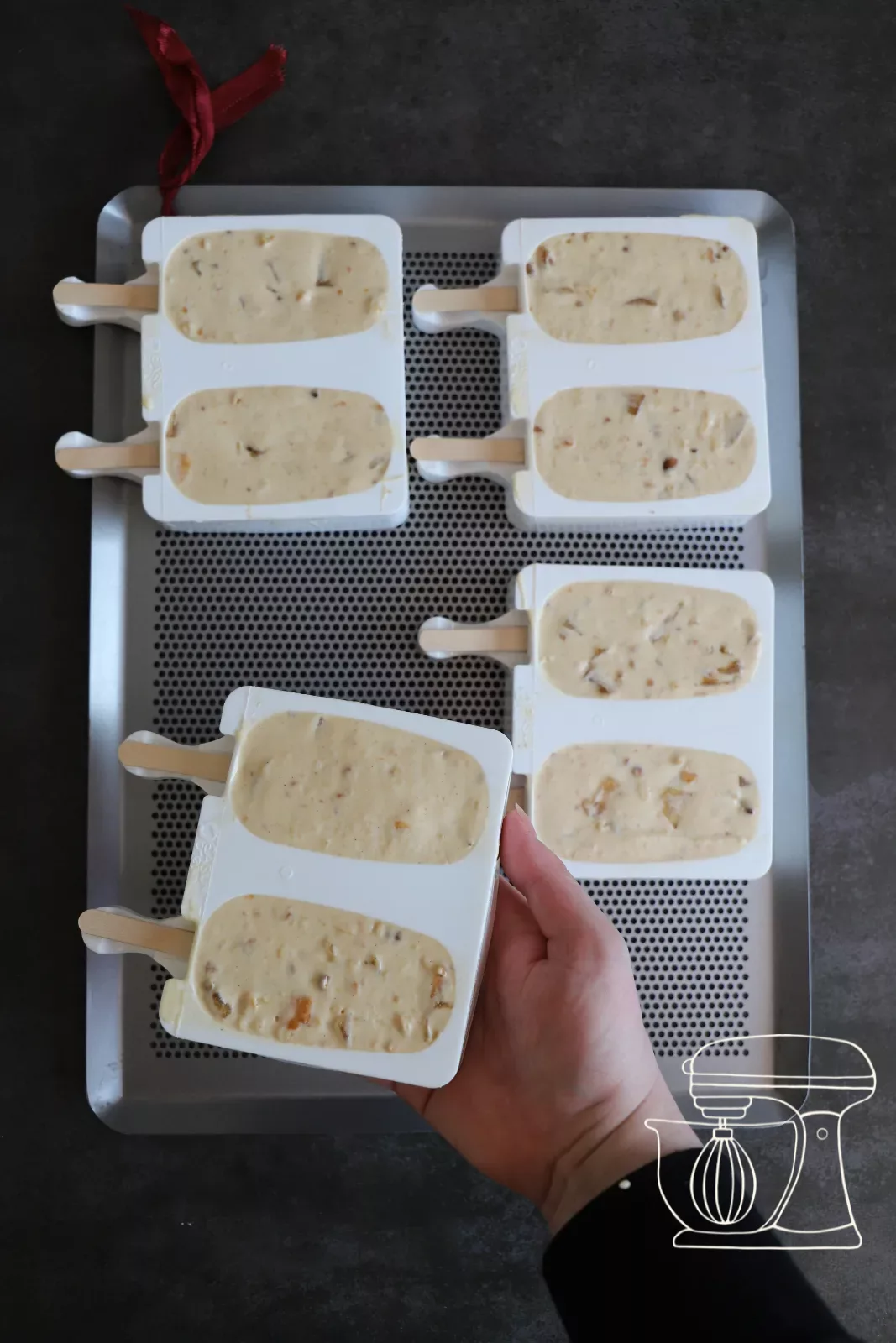 Cakesicle moulds on a tray ready for the freezer